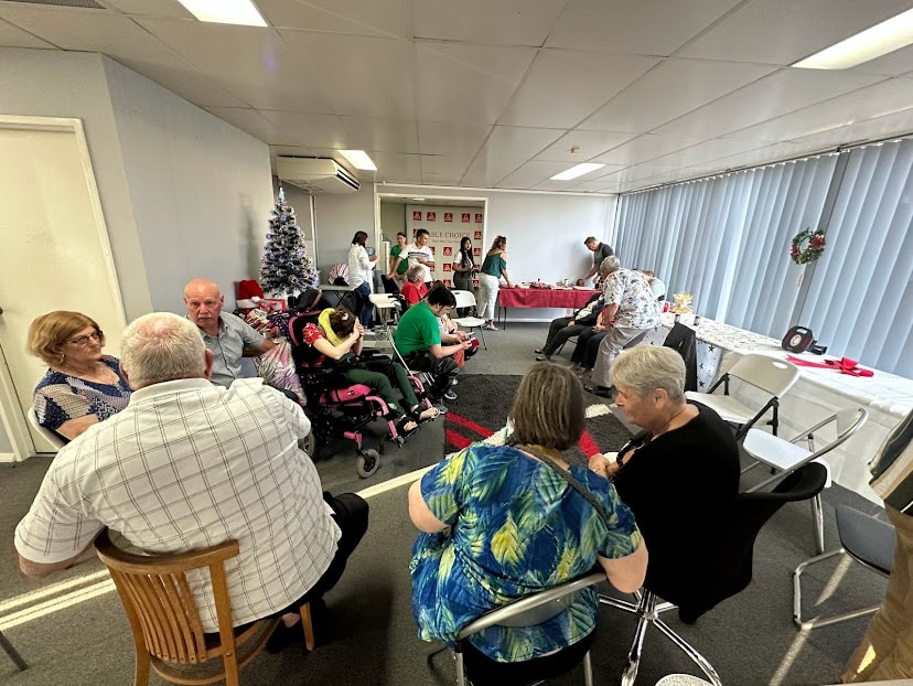 Able Choice Christmas gathering with participants and families