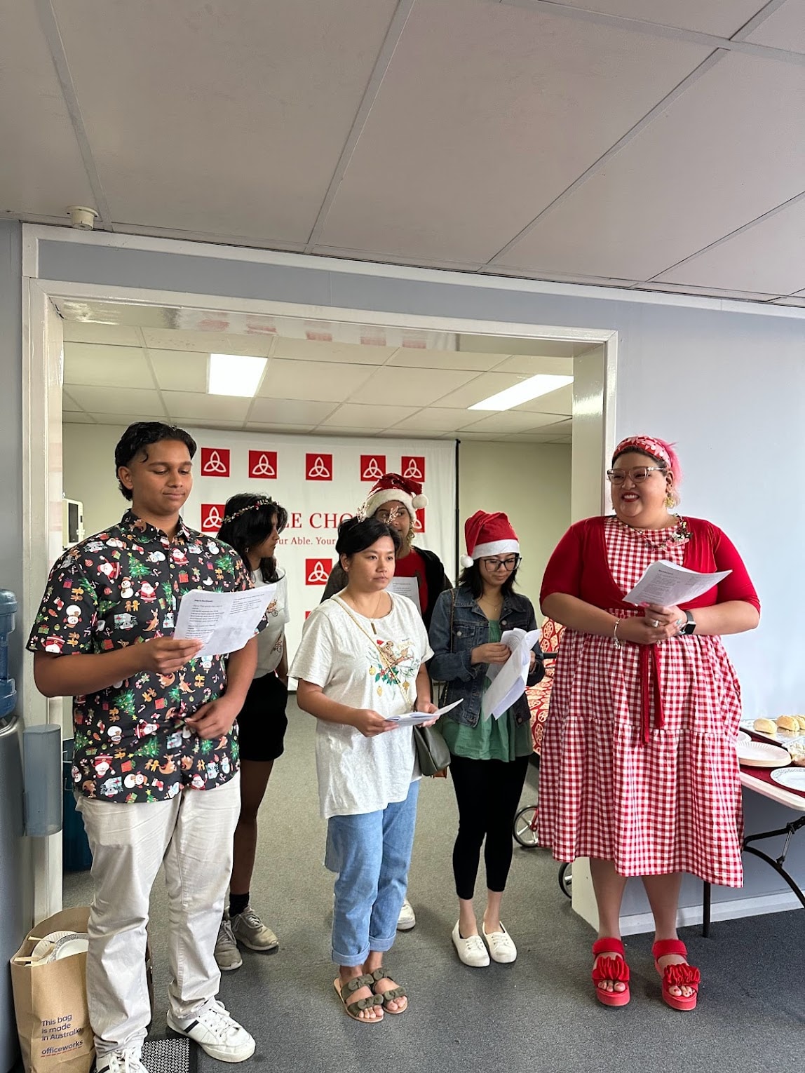 Able Choice team carol singing at the Christmas party